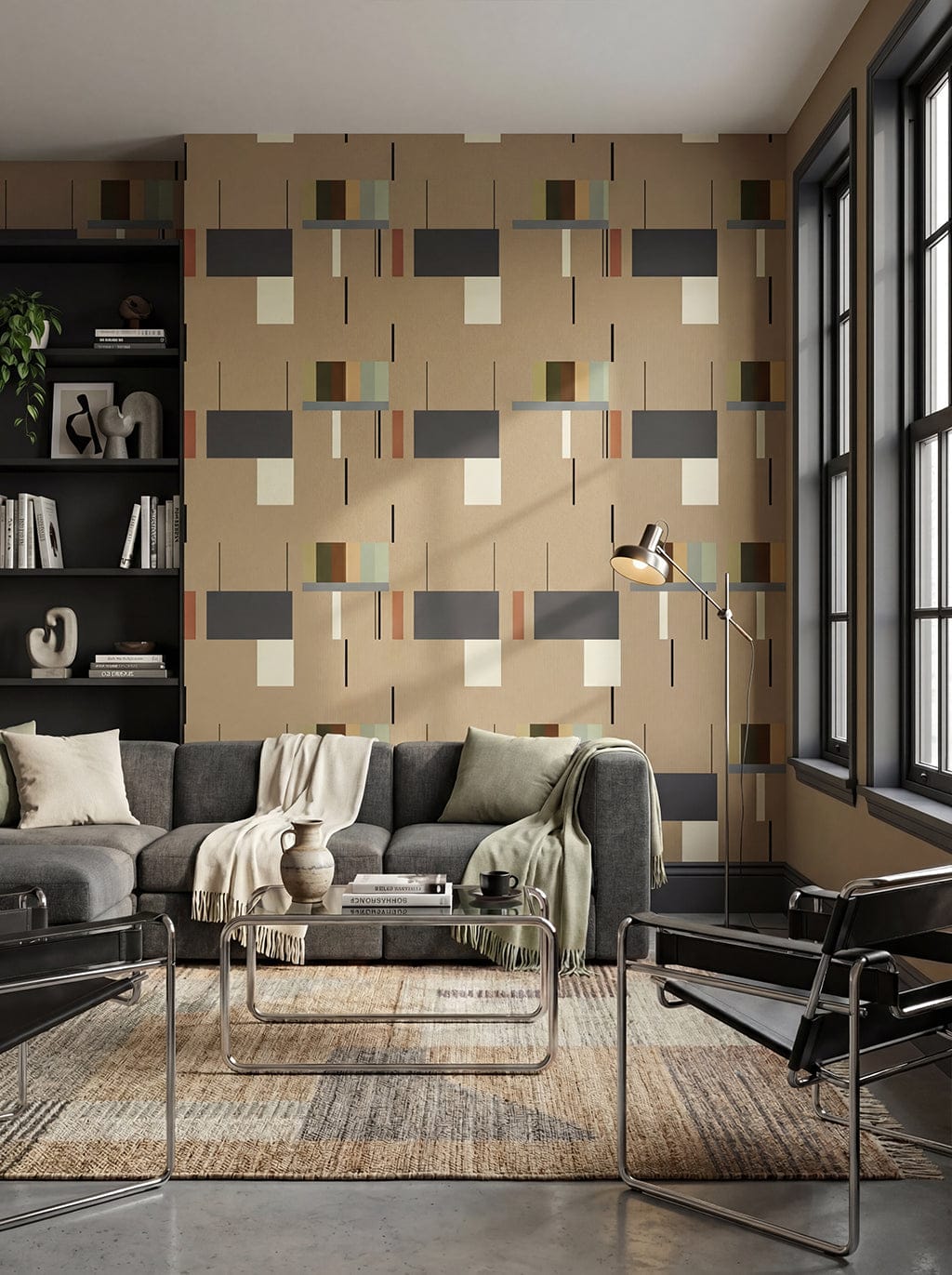 Modern living room with a geometric patterned wall, gray sectional sofa, and glass coffee table.