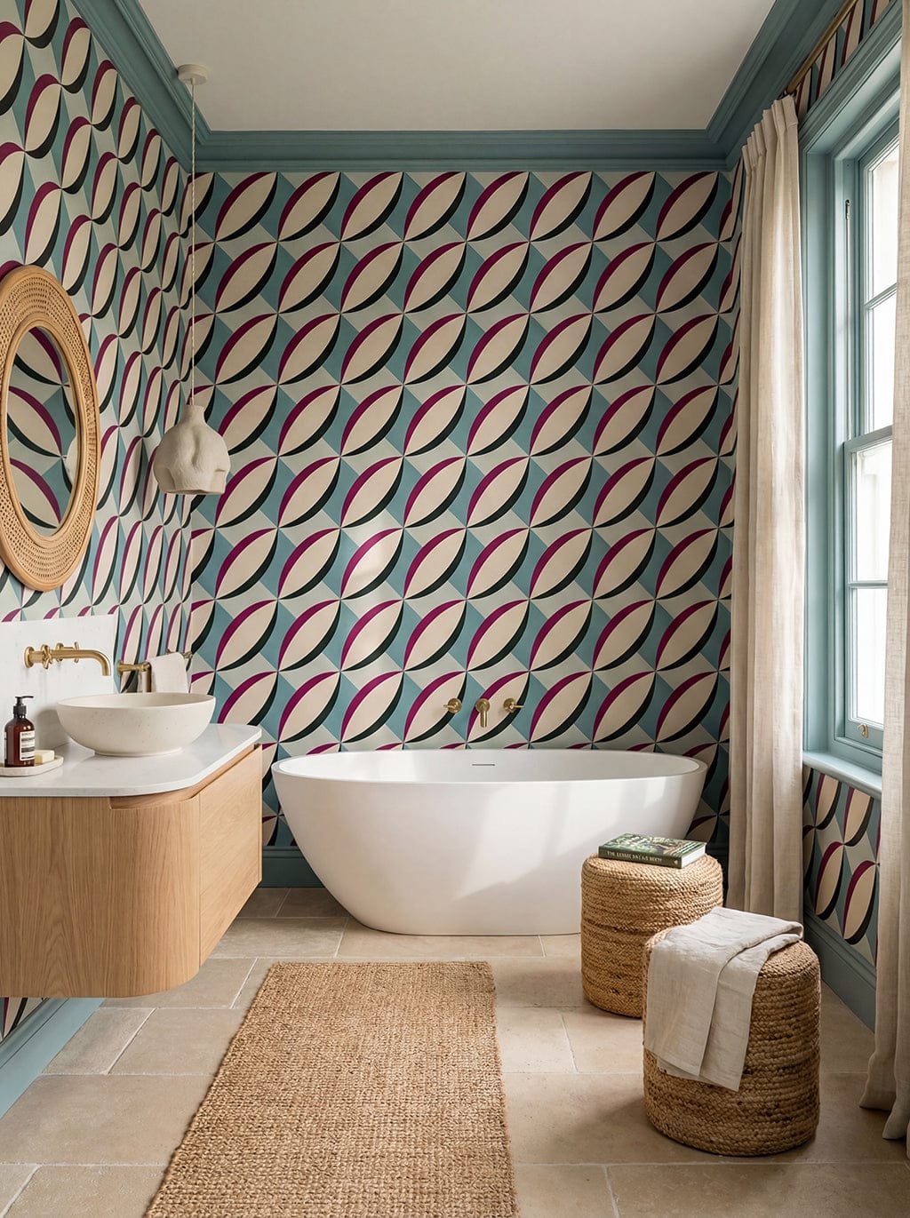 Bathroom with geometric patterned wallpaper, freestanding bathtub, and wooden vanity.