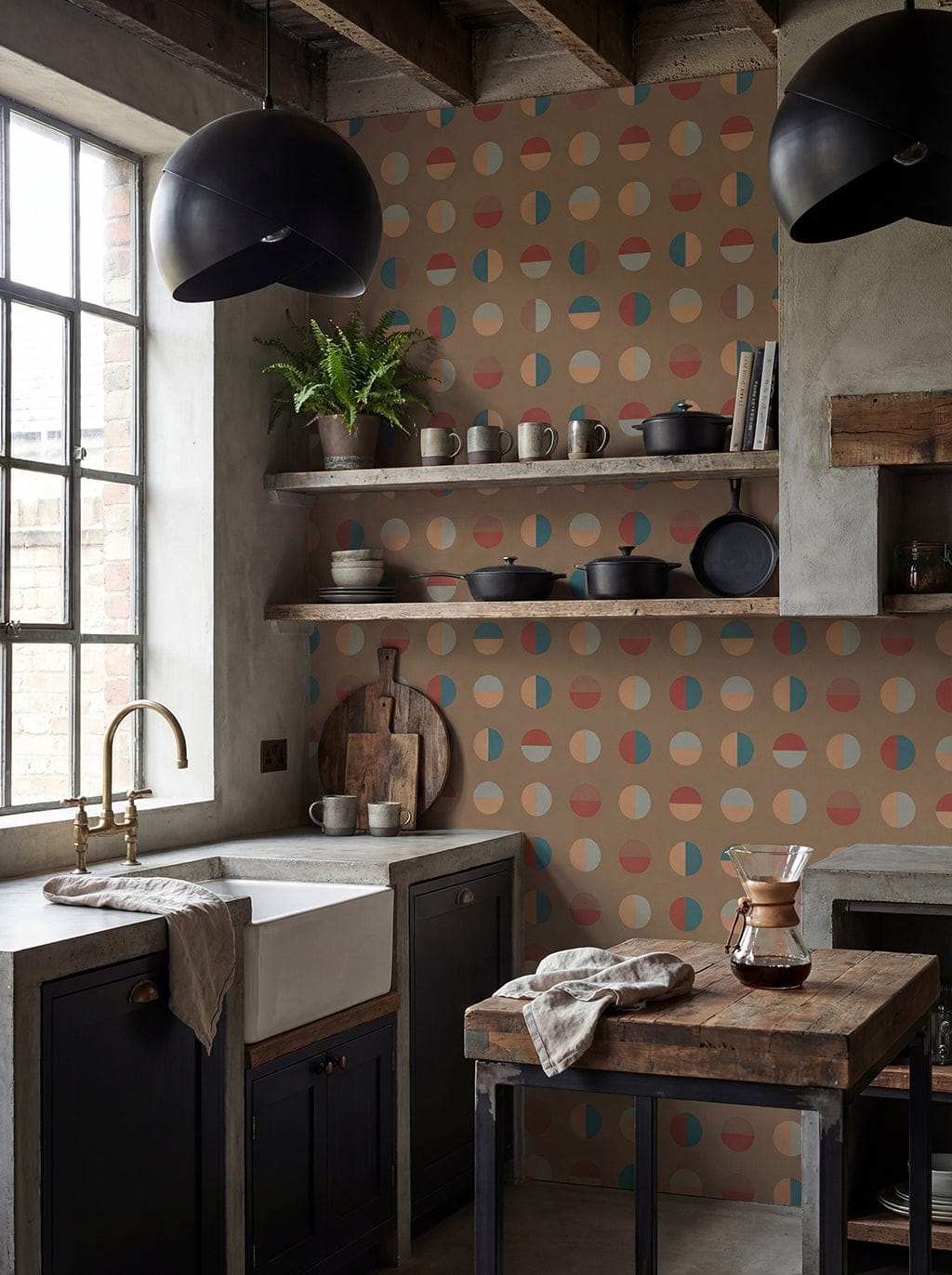 Modern kitchen with polka dot wall, wooden shelves, and a window.