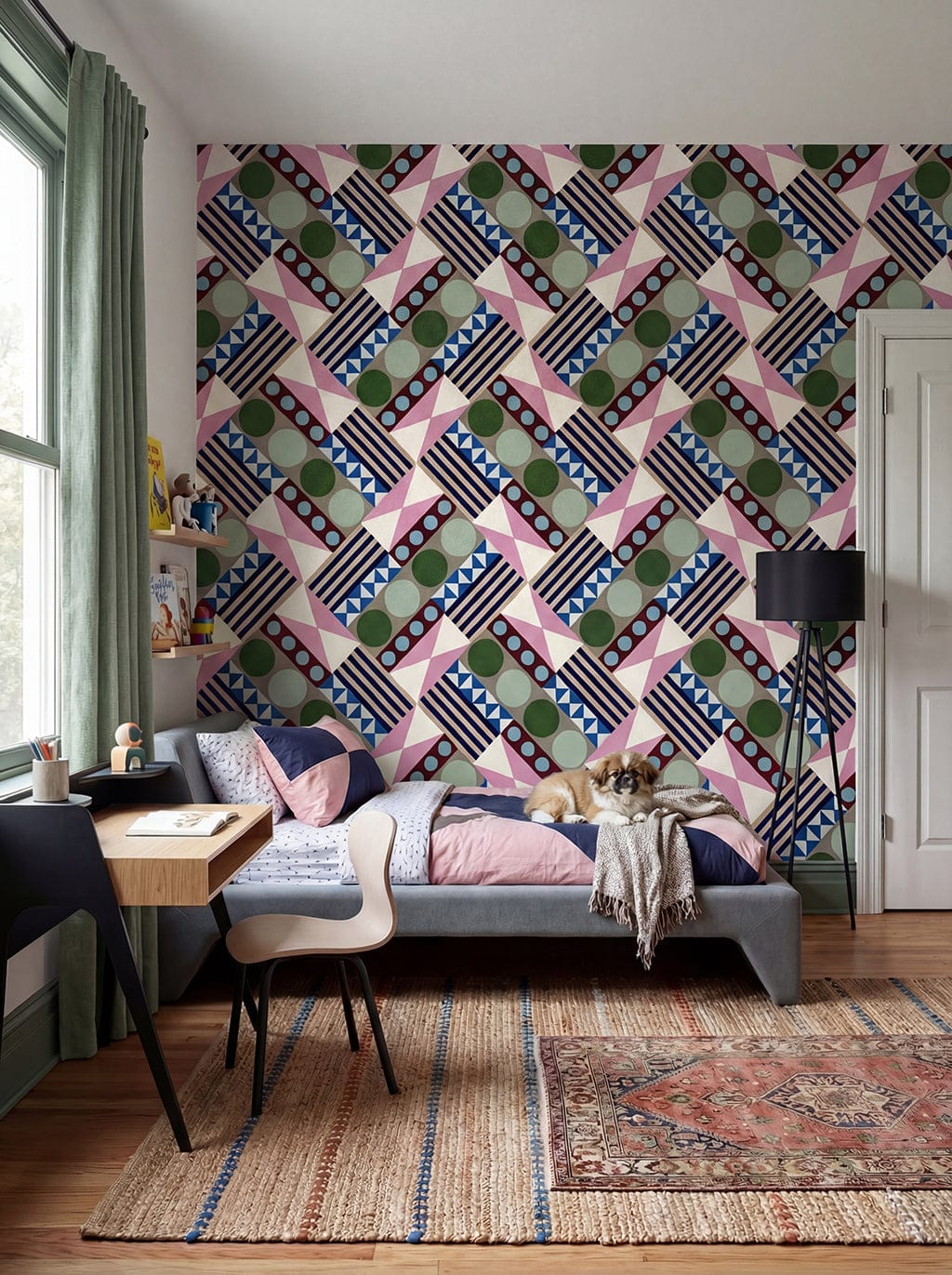 Living room with geometric patterned wall, sofa, and rug.