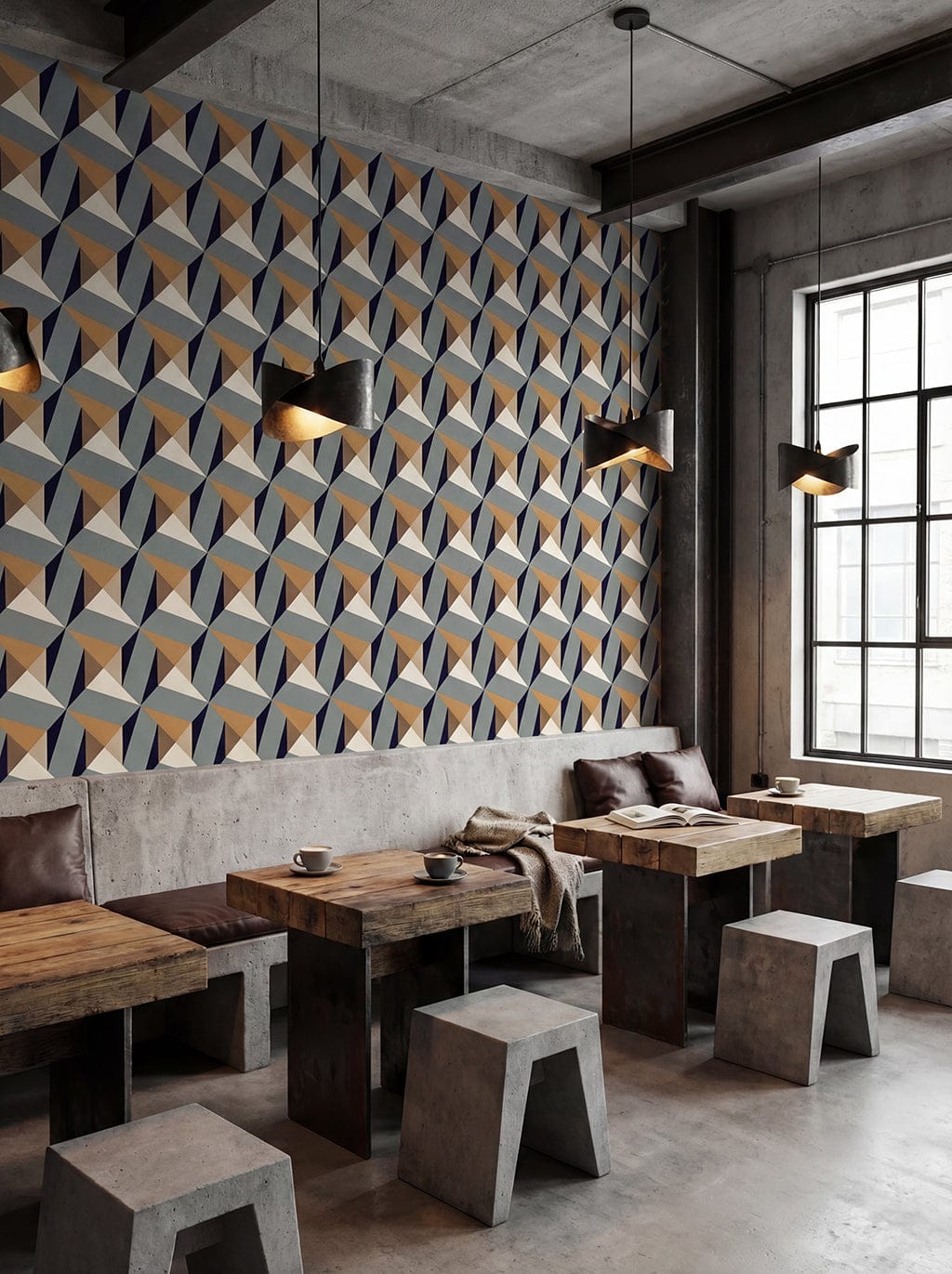 Modern restaurant interior with geometric wall design and wooden tables.