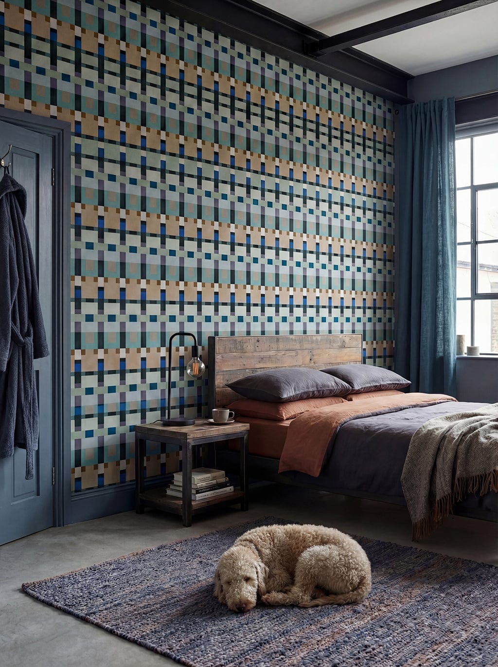 Bedroom with geometric patterned wallpaper, wooden bed, and dog on rug