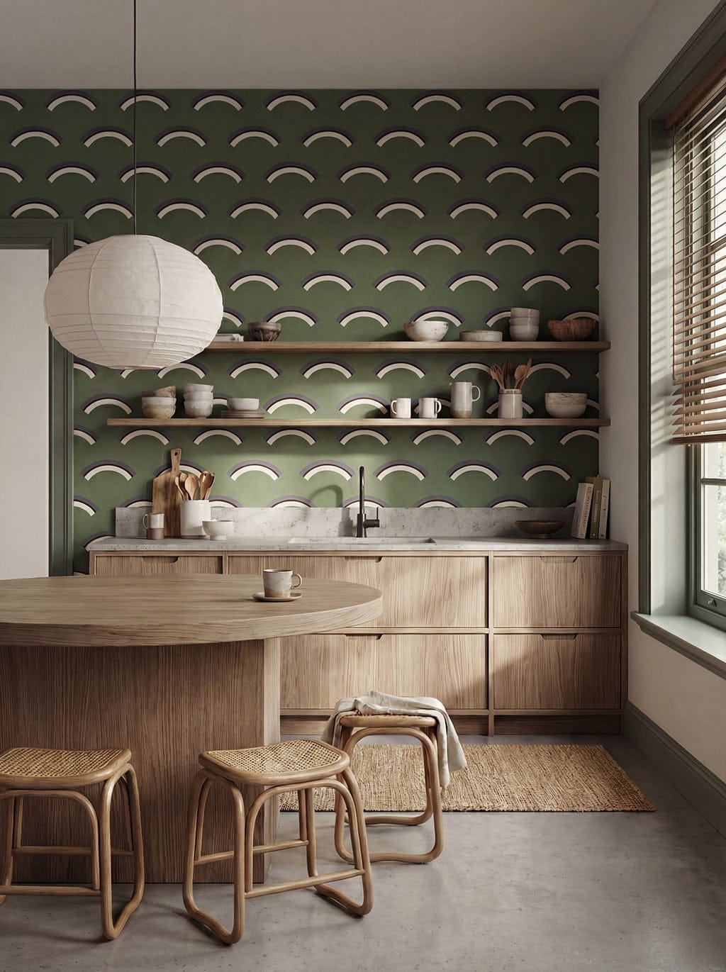 Modern kitchen with green patterned wall, wooden cabinets, and round table.