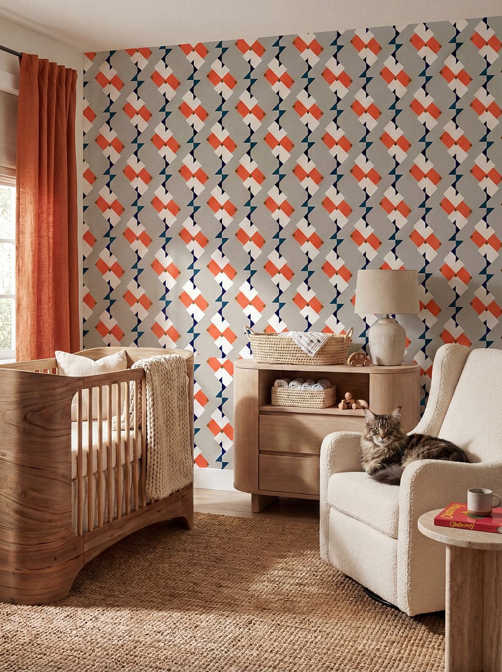 Nursery room with geometric patterned wallpaper, wooden crib, and armchair.